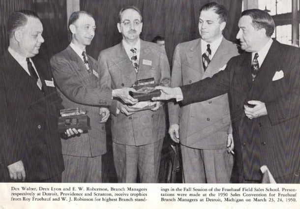 Dew Walter, Drex Lyon, and E.W. Robertson, branch managers, respectively at Detroit, Providence and Scranton receive trophies from Roy Fruehauf and W. J. Robinson