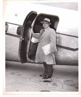 Roy Fruehauf, President, Fruehauf Trailer Company in front of a Lockheed Leerstar airplane